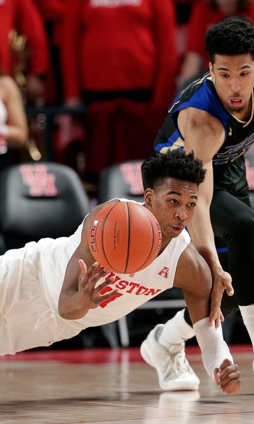 Davis scores 21 points, No. 19 Houston beats Tulsa 74-56